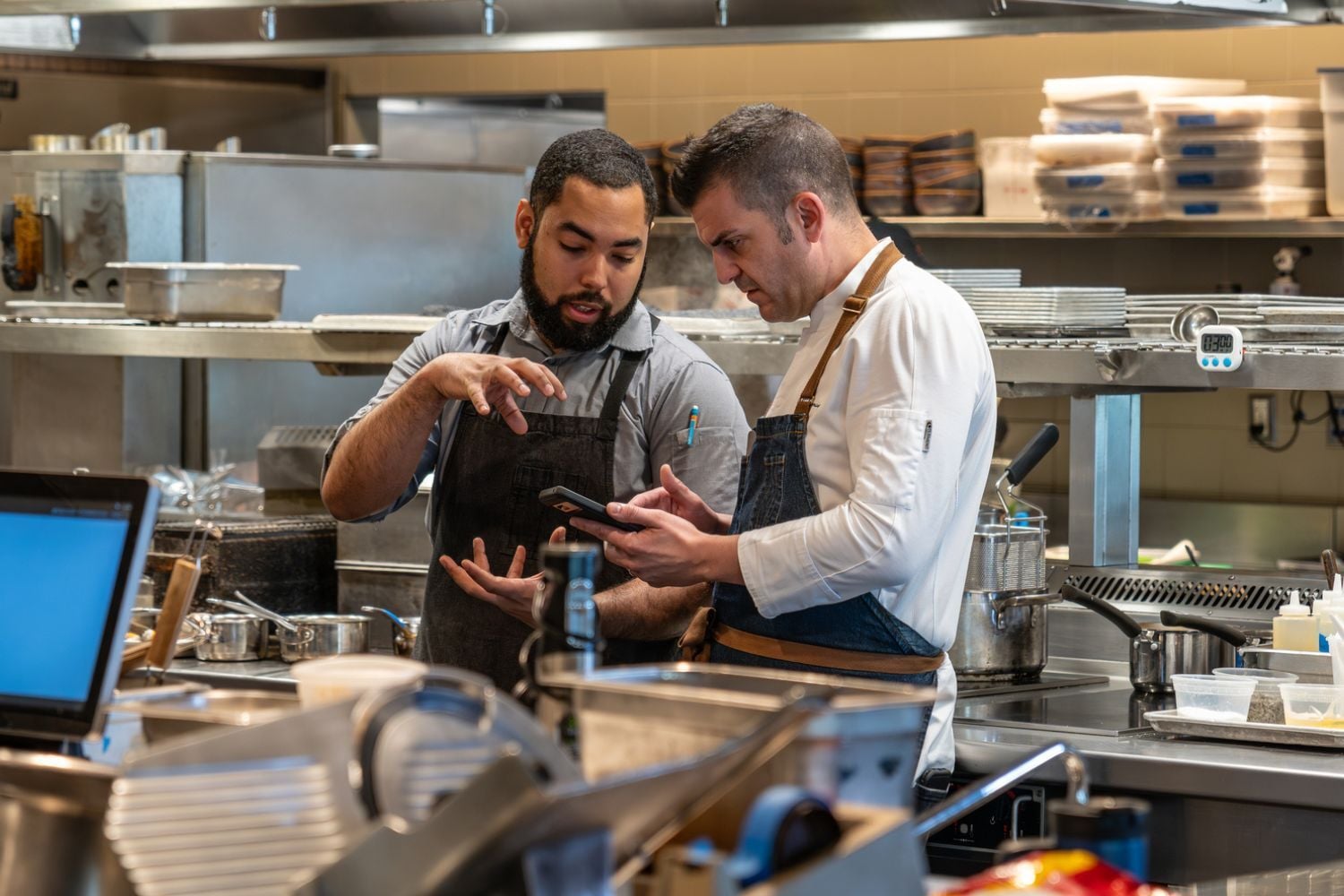 Cranes chef using MarginEdge in kitchen